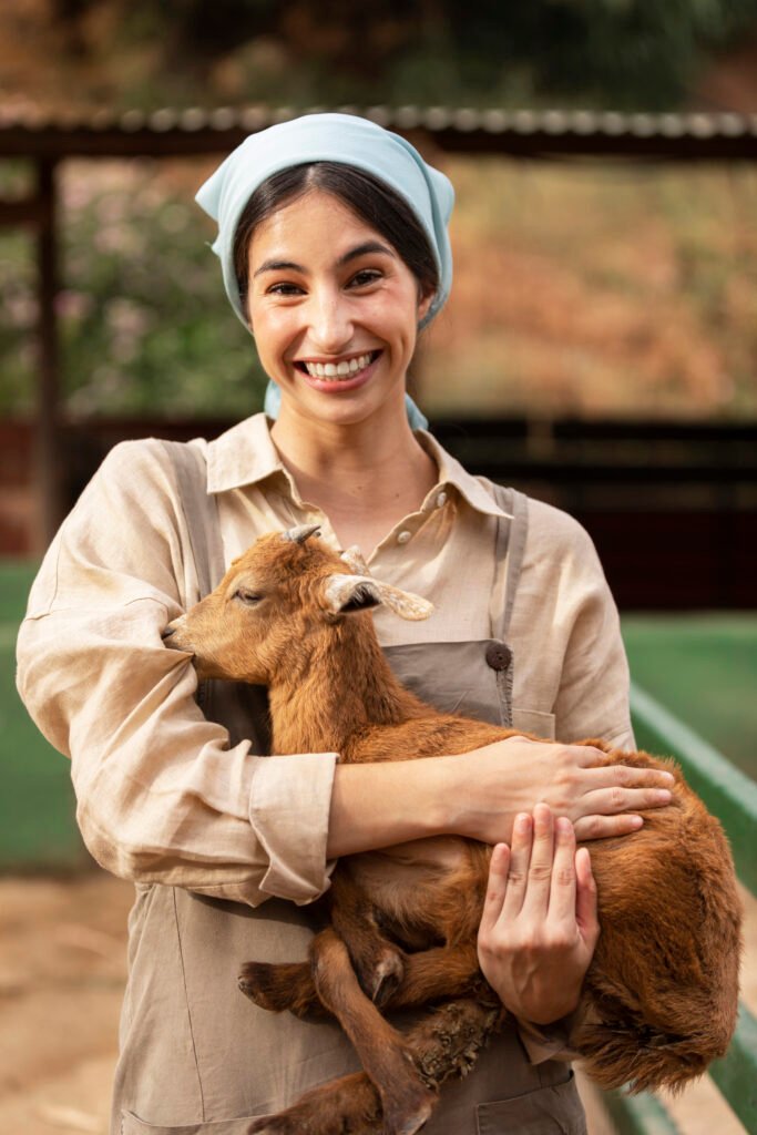 front-view-smiley-woman-holding-goat